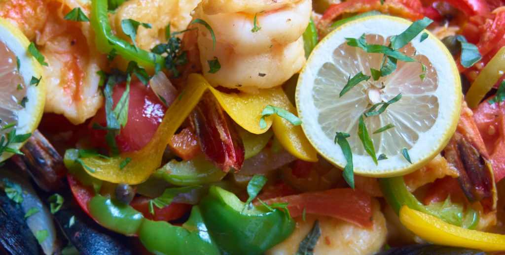 A close-up of a plate of seafood and vegetables, perfect for those spending a lot of time at home.