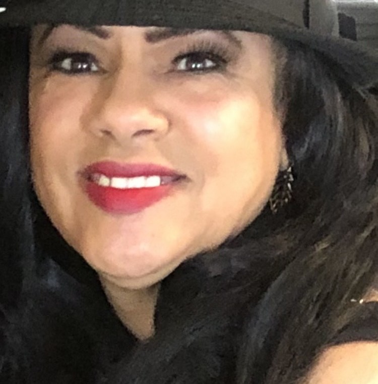 Resident Spotlight on Sonya C, a woman wearing a black hat and lipstick on the 6th floor.