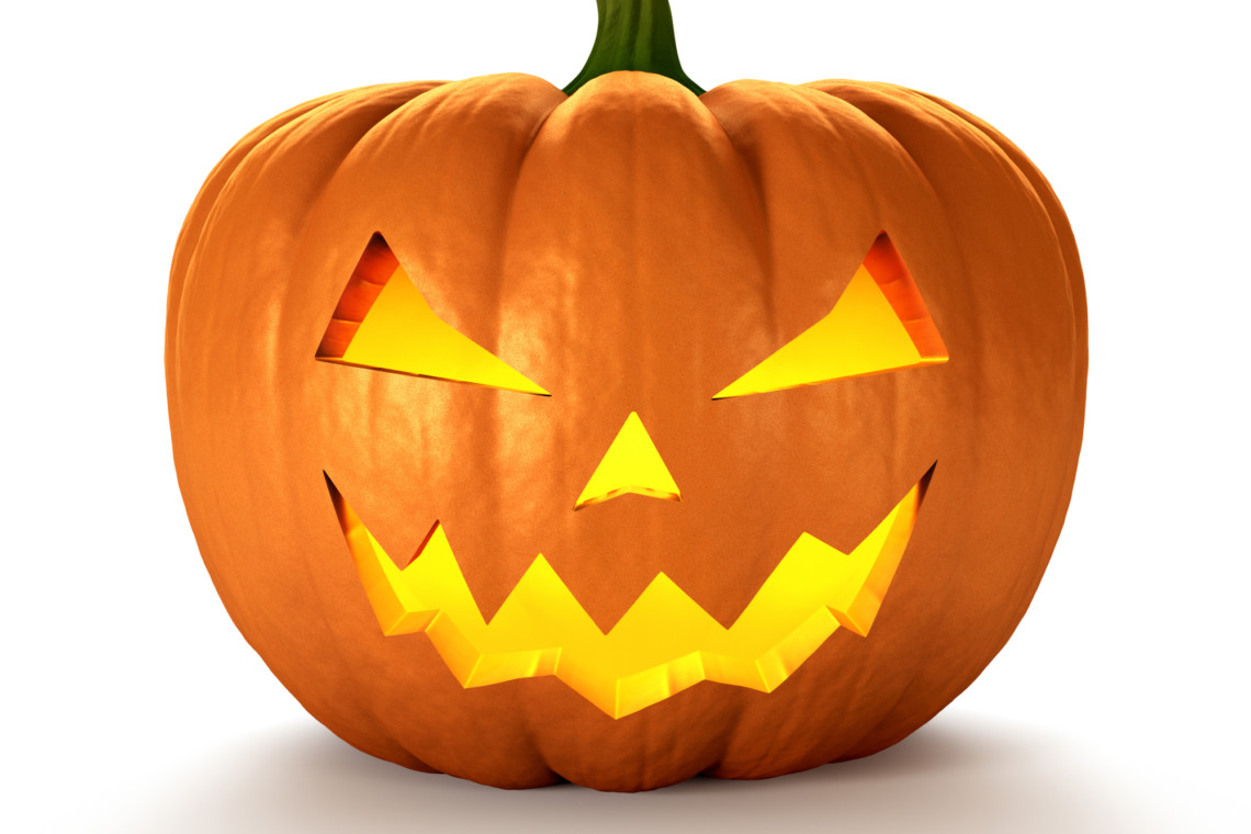 A carved pumpkin with glowing eyes participating in a pumpkin carving contest.