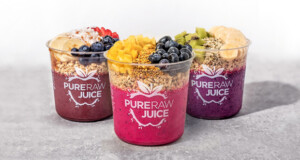 Three cups of smoothies with fruit and berries from Pure Raw Juice